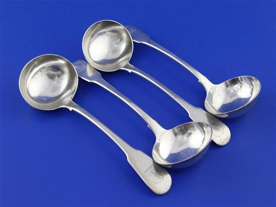 A set of four George III silver fiddle pattern sauce ladles by William Chawner II, 8 oz.